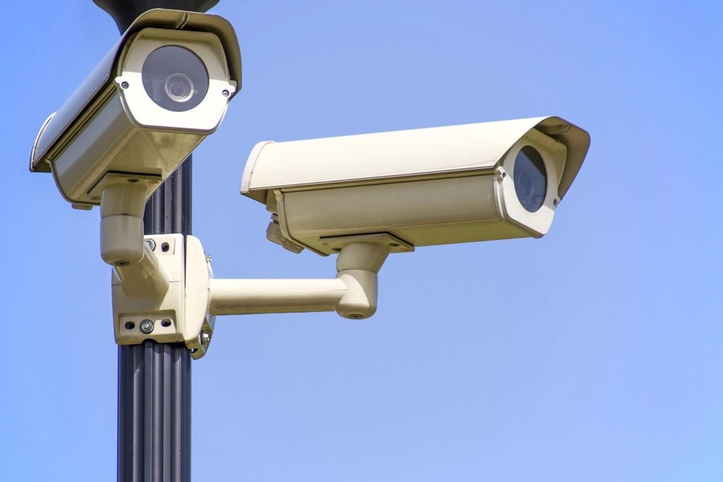 Commercial security cameras mounted on a pole.