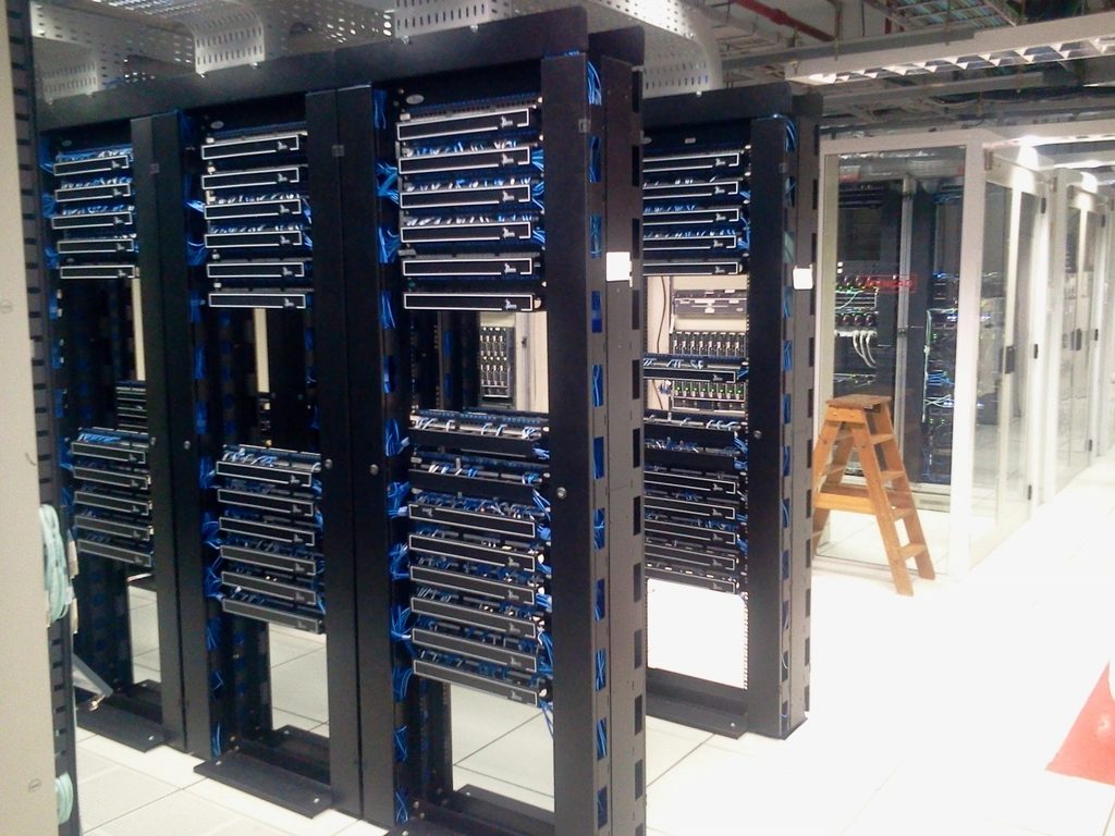 Structured cabling and network racks in a server room.